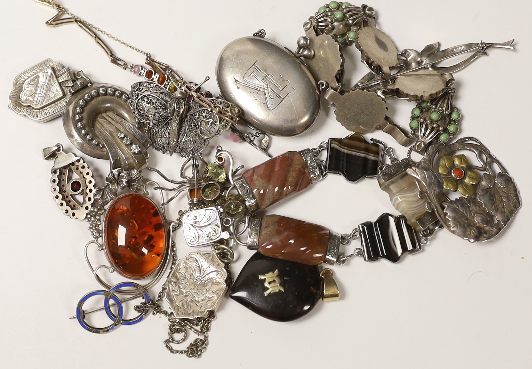 A small quantity of Victorian and later jewellery, including white metal and agate set bracelet, a yellow metal and graduated multi gem set bracelet (including zircon and garnet), lockets, brooches, etc.